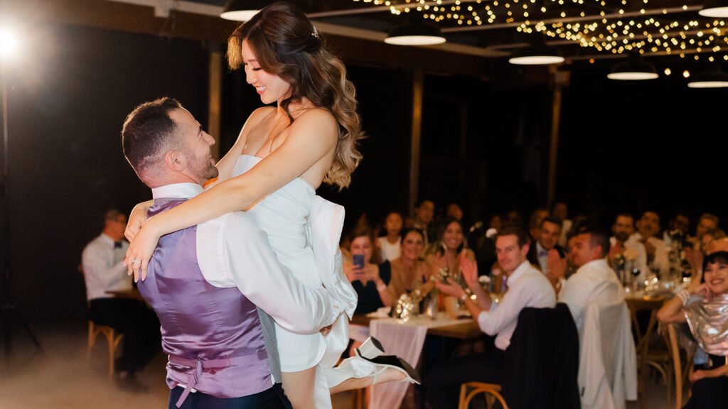 A bride and groom perform their choreographed first dance.