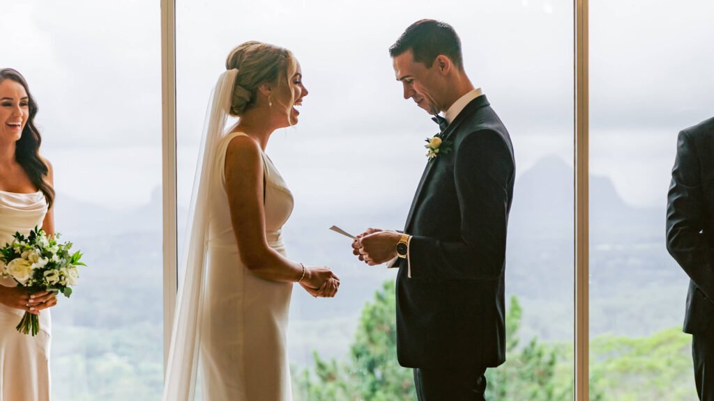 A groom says his vows to his bride during their wedding ceremony at Tiffanys Maleny.
