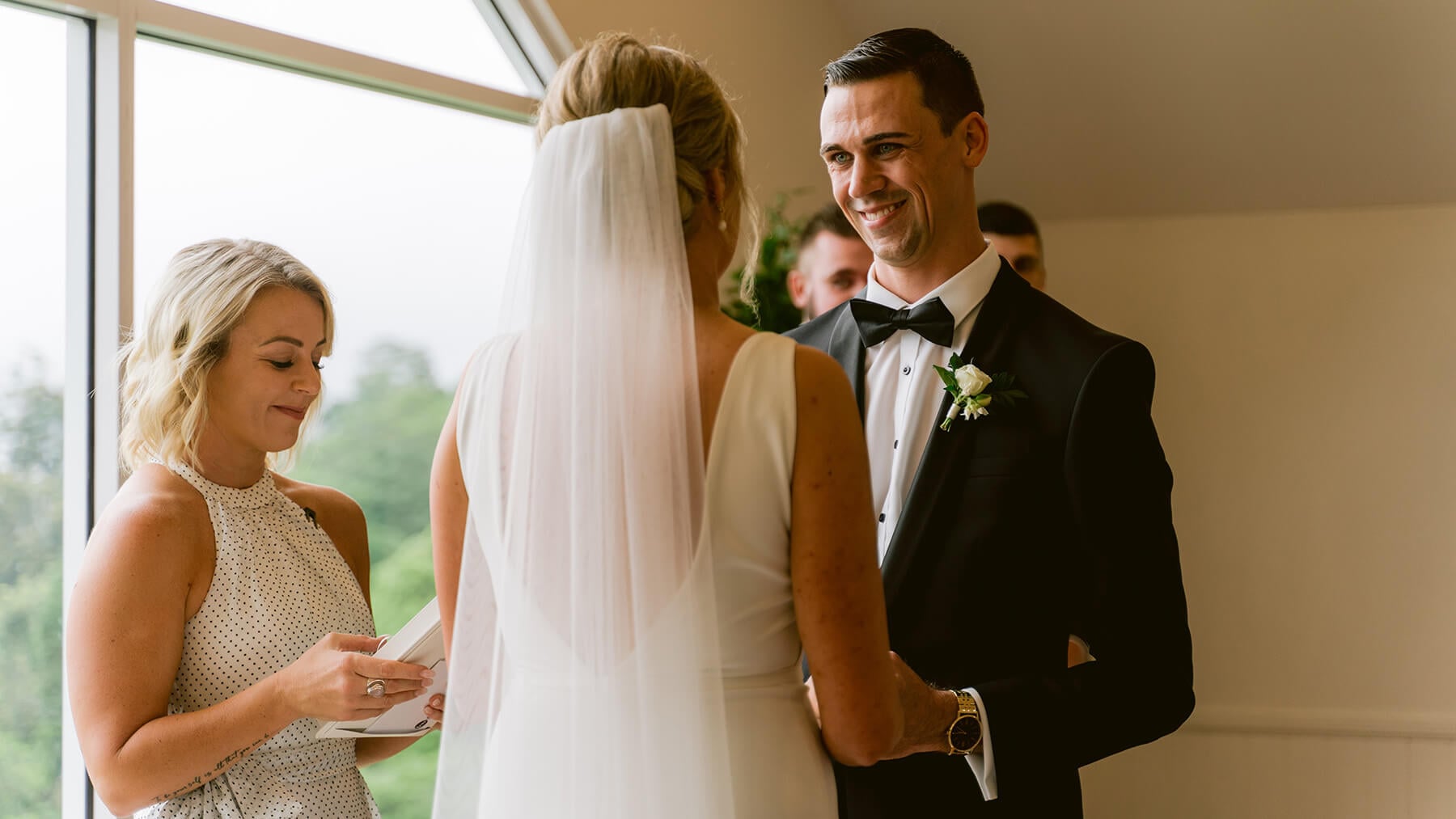 A groom saying this wedding vows to his wife during a wedding ceremony on the Sunshine Coast.